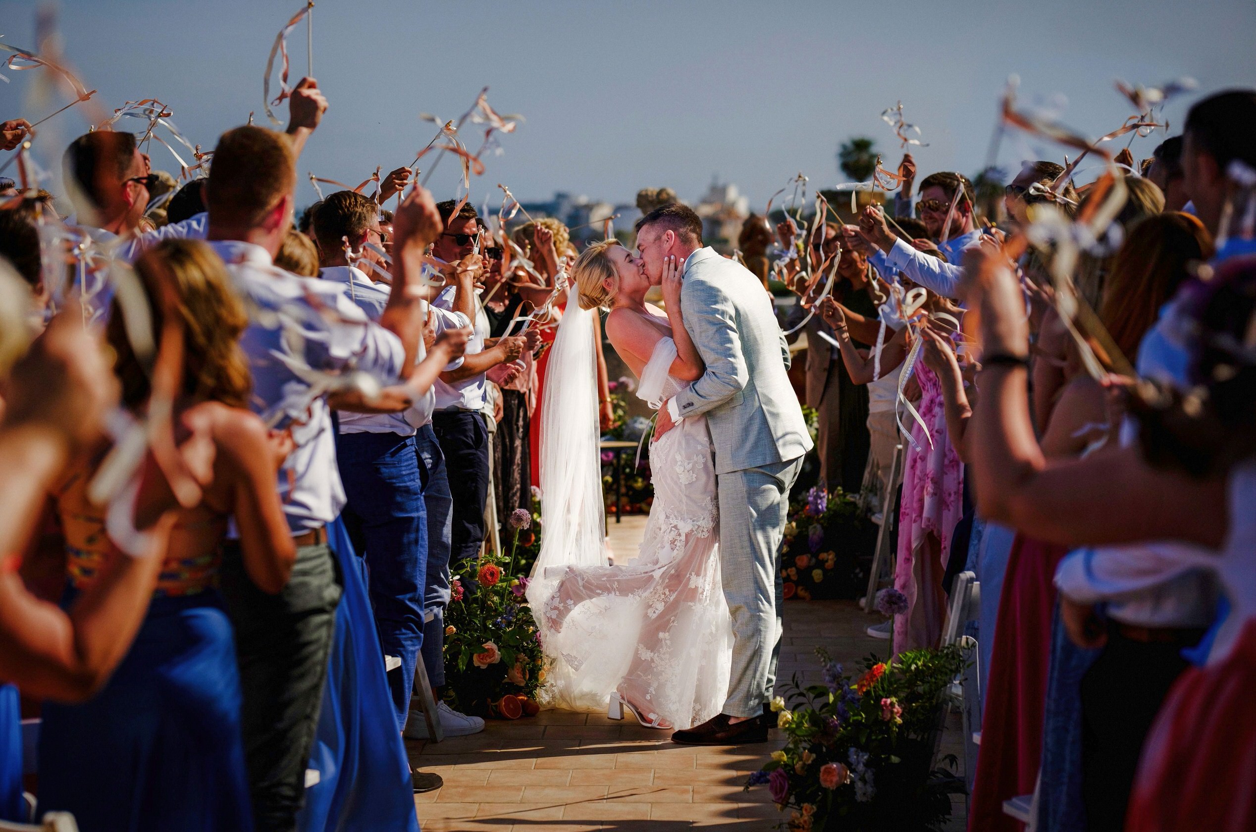 Bride and groom’s first kiss at their PortVerd wedding in Mallorca. Authentic, cinematic wedding photography with a stunning seaside backdrop.